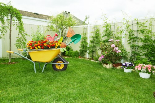 Professional garden maintenance service working on a lush garden in Kentish Town